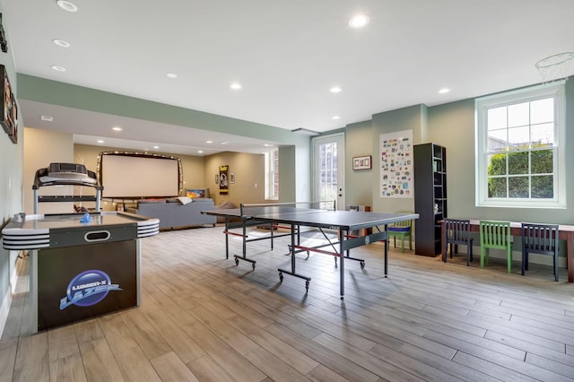 game room with recessed lighting and wood finished floors