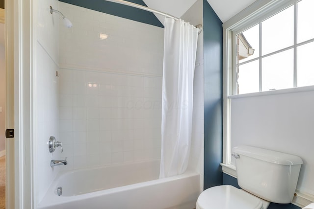 full bathroom featuring toilet and shower / bath combo with shower curtain