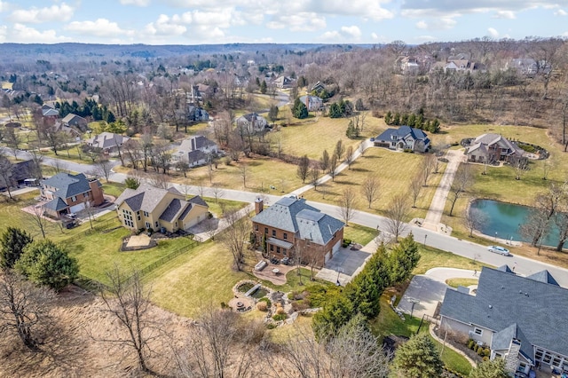 bird's eye view with a water view and a residential view