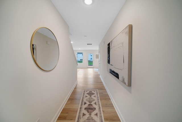 corridor with recessed lighting, light wood-style flooring, visible vents, and baseboards