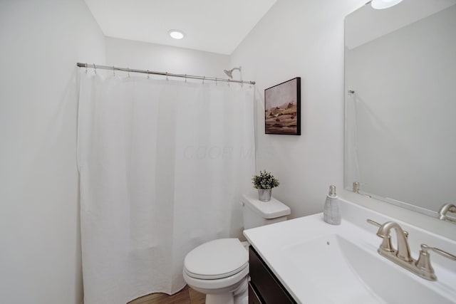 full bath featuring vanity, curtained shower, and toilet