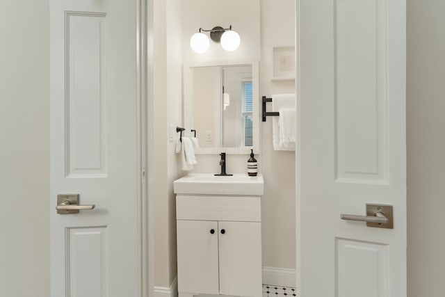 bathroom featuring vanity and baseboards