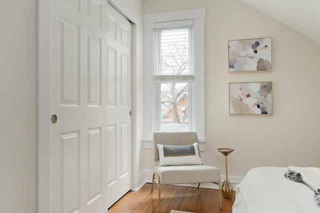 bedroom with a closet and wood finished floors