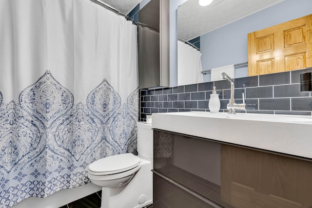 full bath with a shower with curtain, a textured ceiling, tile patterned floors, toilet, and tasteful backsplash