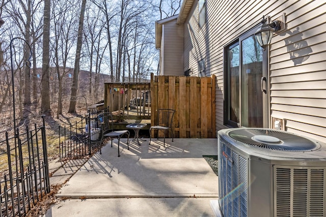 view of patio / terrace with fence and central AC