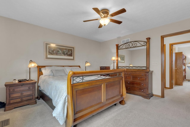 bedroom featuring light carpet, baseboards, and visible vents