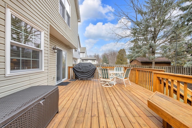 wooden terrace featuring fence and area for grilling