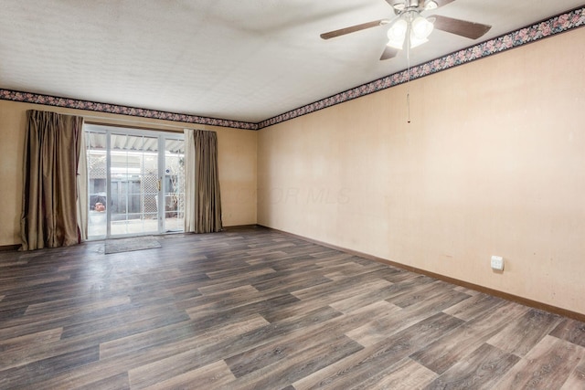 unfurnished room with ceiling fan, baseboards, and dark wood-style flooring