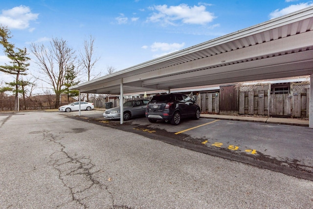 covered parking lot with fence