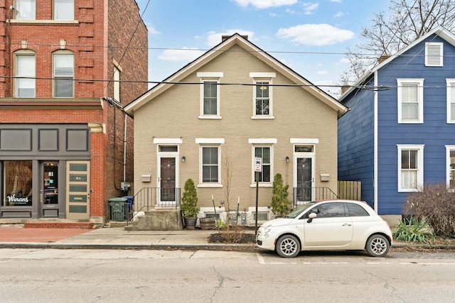 view of property featuring brick siding