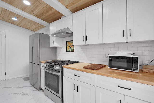 kitchen with black microwave, under cabinet range hood, marble finish floor, stainless steel range with gas cooktop, and decorative backsplash