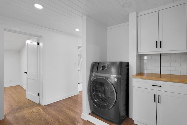 laundry room with washer / dryer, light wood-type flooring, baseboards, and recessed lighting