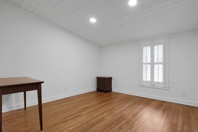 spare room featuring recessed lighting, wooden ceiling, baseboards, and hardwood / wood-style floors