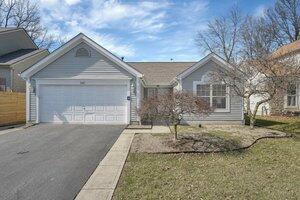 single story home with an attached garage and driveway