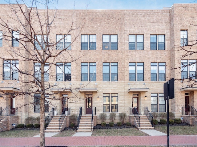 view of property with brick siding