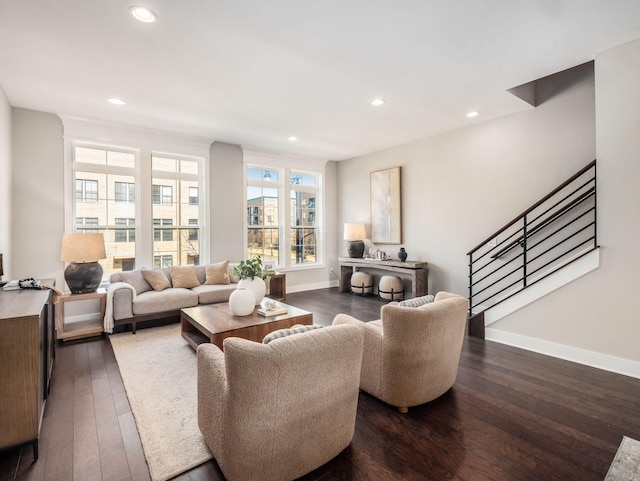 living room with recessed lighting, stairs, baseboards, and dark wood-style flooring