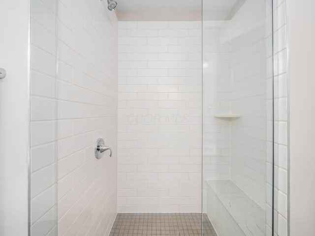 full bathroom with tiled shower