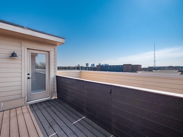 wooden terrace with a city view