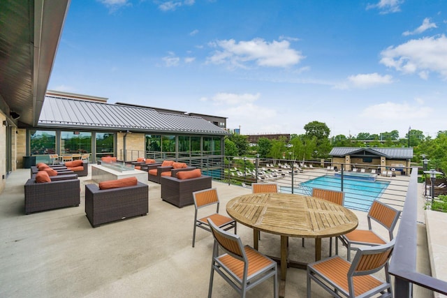 community pool featuring an outdoor living space, a patio, and outdoor dining space