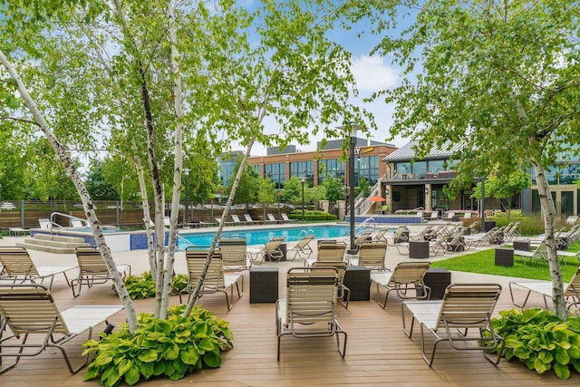 exterior space featuring a patio area, a community pool, and fence