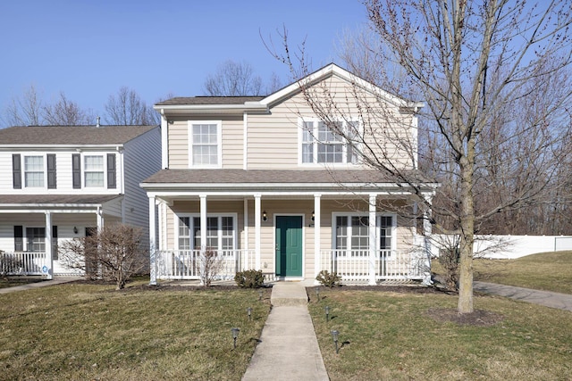 view of front of property with a porch and a front yard