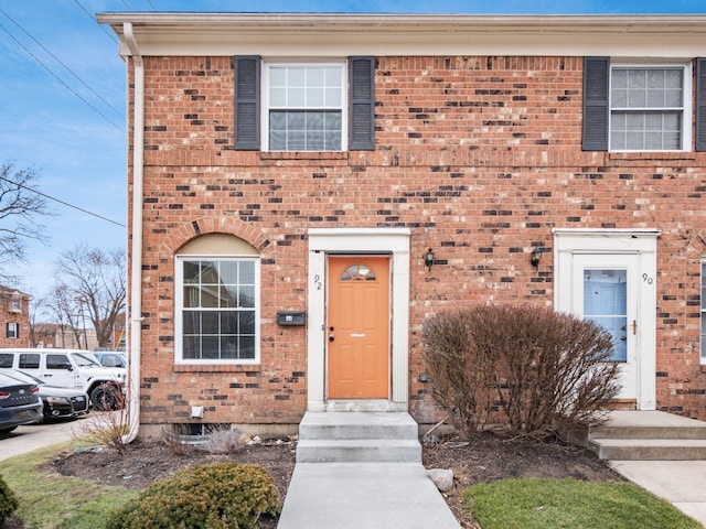 view of front of home featuring brick siding