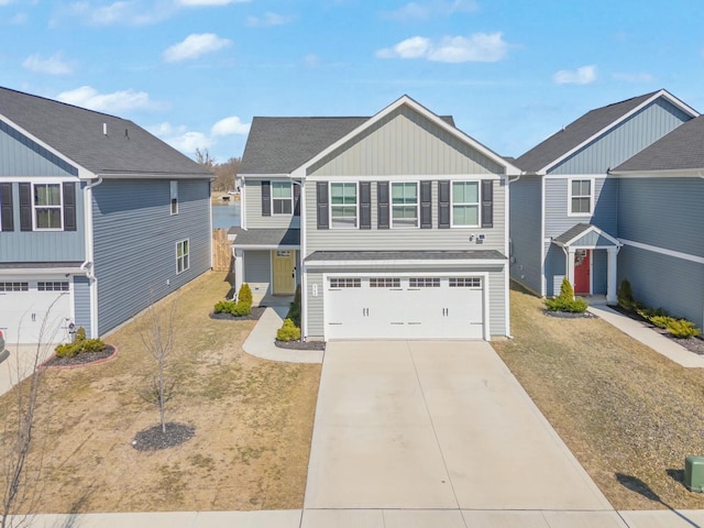 view of front facade featuring board and batten siding, concrete driveway, a garage, and a front lawn