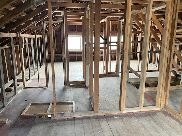 misc room featuring lofted ceiling and hardwood / wood-style flooring