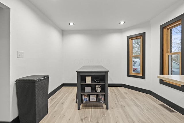 interior space with recessed lighting, wood finished floors, visible vents, and baseboards