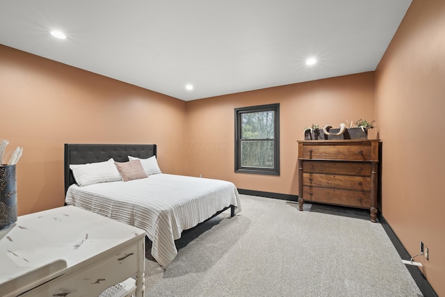 bedroom featuring recessed lighting, light colored carpet, and baseboards