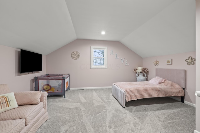 bedroom featuring baseboards, carpet floors, and lofted ceiling