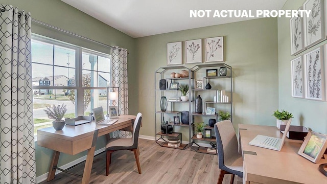 office featuring light wood-style flooring and baseboards