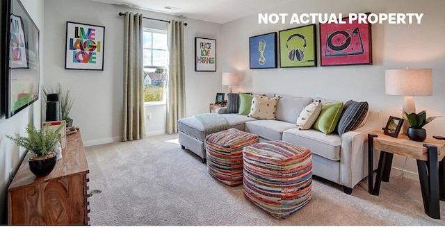 living area featuring visible vents, baseboards, and carpet