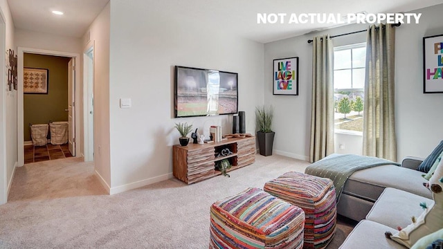 carpeted living room with baseboards