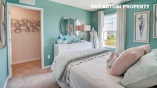 bedroom with light colored carpet, visible vents, and baseboards