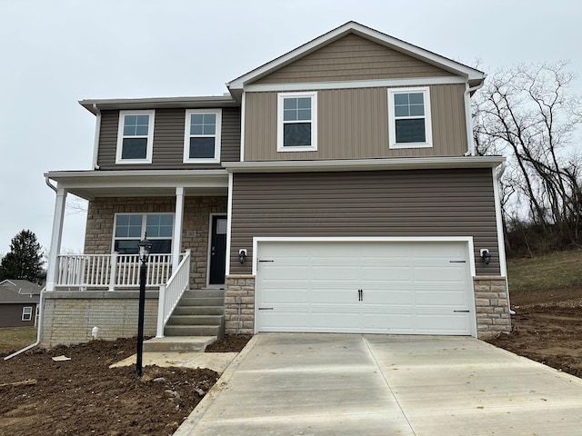 view of front of house featuring driveway, stone siding, board and batten siding, covered porch, and an attached garage