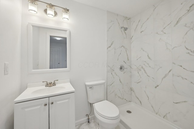 bathroom with a marble finish shower, baseboards, toilet, marble finish floor, and vanity