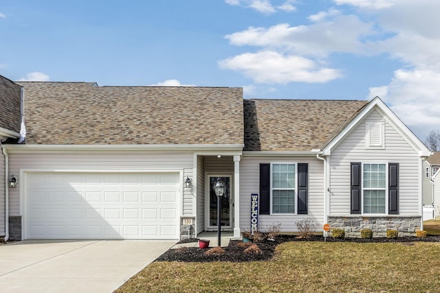 view of front of house with concrete driveway, a garage, stone siding, and roof with shingles