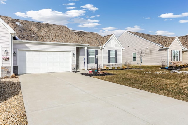 single story home featuring a garage, stone siding, a front yard, and driveway