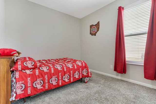 carpeted bedroom with baseboards