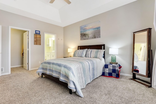 bedroom featuring visible vents, baseboards, ensuite bath, ceiling fan, and light colored carpet