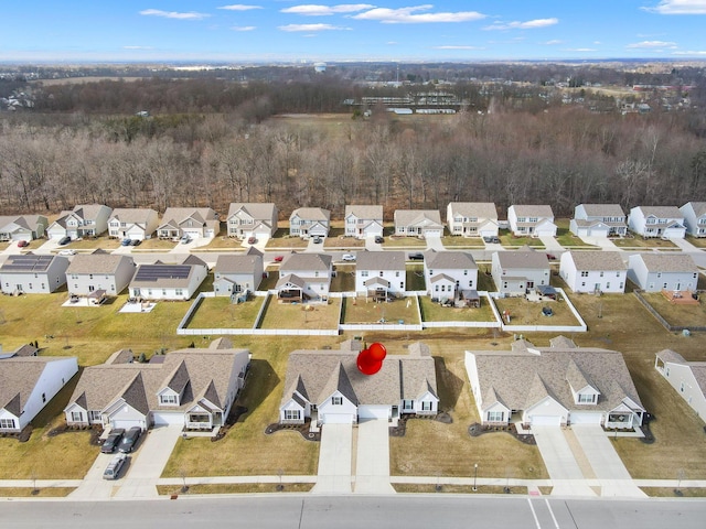 birds eye view of property with a residential view