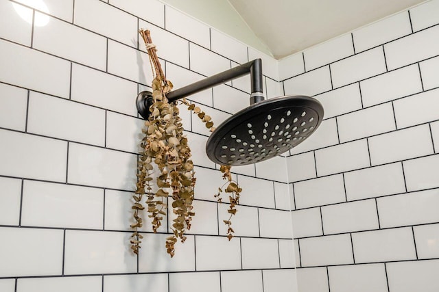 details with a tile shower