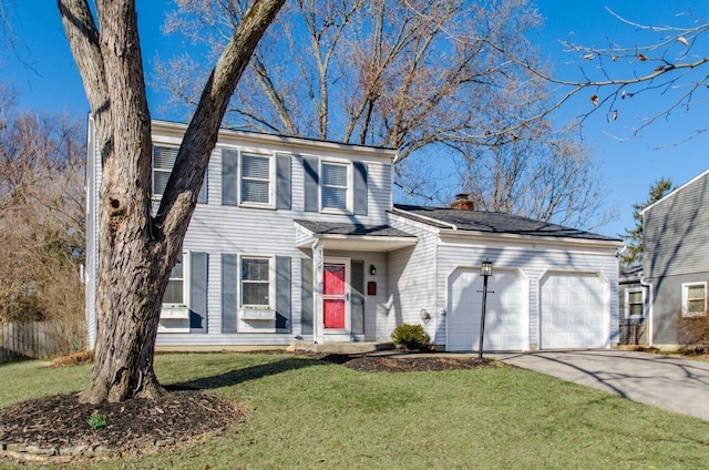 view of front of home with an attached garage, a chimney, concrete driveway, and a front yard