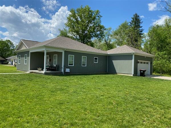 view of front of property with an attached garage and a front yard