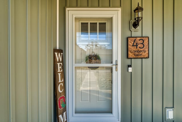 property entrance with board and batten siding