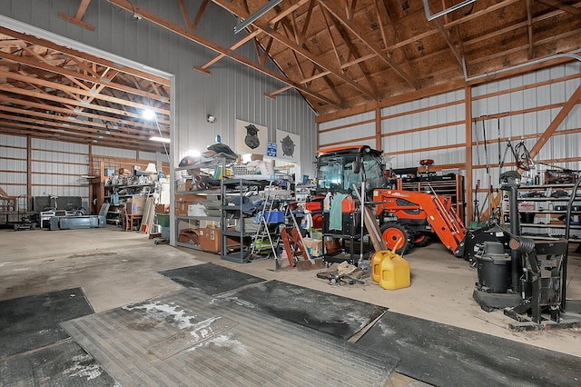 garage featuring metal wall and a workshop area