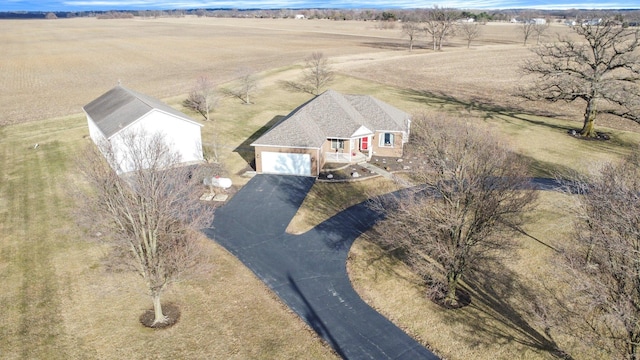 birds eye view of property featuring a rural view