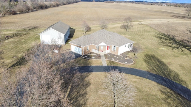 birds eye view of property with a rural view