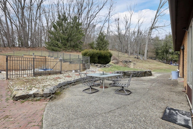 view of patio with fence and outdoor dining area